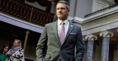 Rep. Riley Moore, R-W.Va., walks through the Old Senate Chamber of the Capitol on Jan. 14.