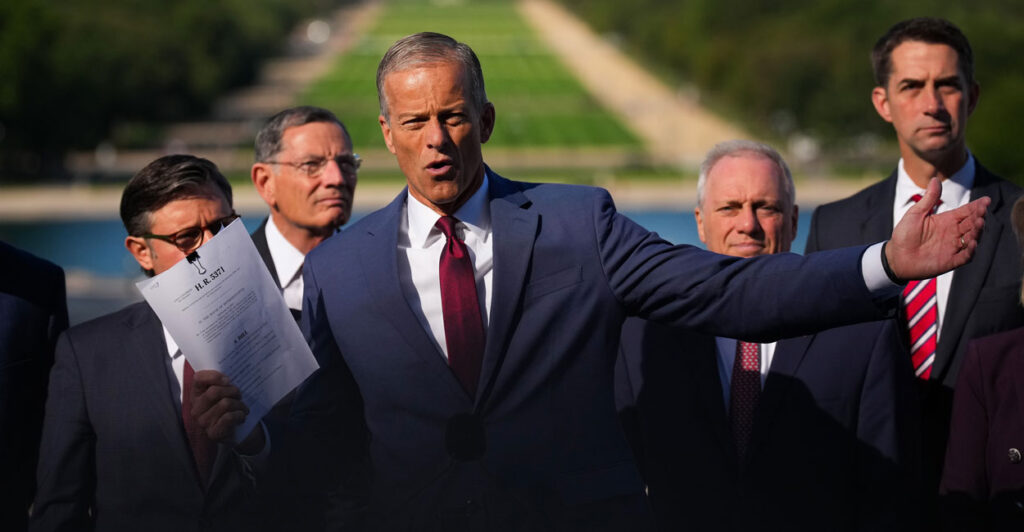 Senate Majority Leader John Thune, R-S.D., speaking at a Republican leadership press conference Wednesday, holds up the bill text of a seven-week continuing resolution.