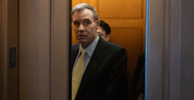 Senator Mark Warner (D-VA) boards an elevator at the U.S. Capitol