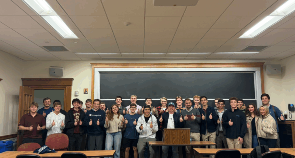 Members of the Boston College Republicans pose with guest speaker Nick Solheim giving thumbs up.