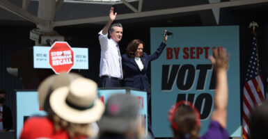 California Gov. Gavin Newsom (L) and then- Vice President Kamala Harris (R) greet supporters during a No on the Recall campaign event in 2021.
