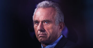 Democratic Presidential Candidate Robert F. Kennedy Jr. listens as he is introduced by Rabbi Shmuley Boteach during the World Values Network's Presidential candidate series at the Glasshouse on July 25, 2023 in New York City.