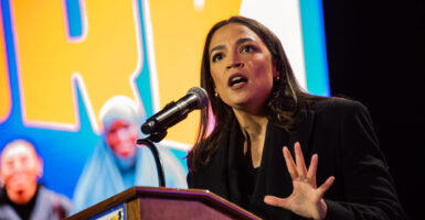 Rep. Alexandria Ocasio-Cortez, D-N.Y., addresses a crowd at Forest Hills Stadium in Queens, New York, for mayoral candidate Zohran Mamdani's campaign on Oct. 26.