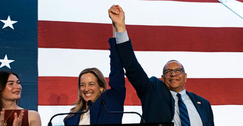 New Jersey Democratic gubernatorial candidate Mikie Sherrill celebrates with her lieutenant governor running mate, Dale Caldwell, after their election victory Tuesday night in East Brunswick, N.J.
