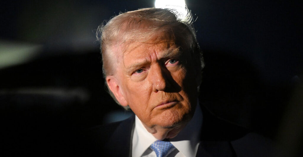 Donald Trump looks straight ahead.