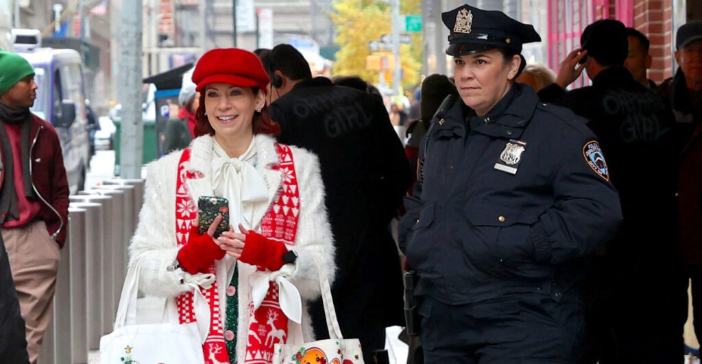 Carrie Preston and Lindsay Mendez bot stand outside a building on the sidewalk in New York City.