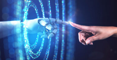 A graphic showing a human finger reaching out to touch a robotic finger emerging from rings of blue light.