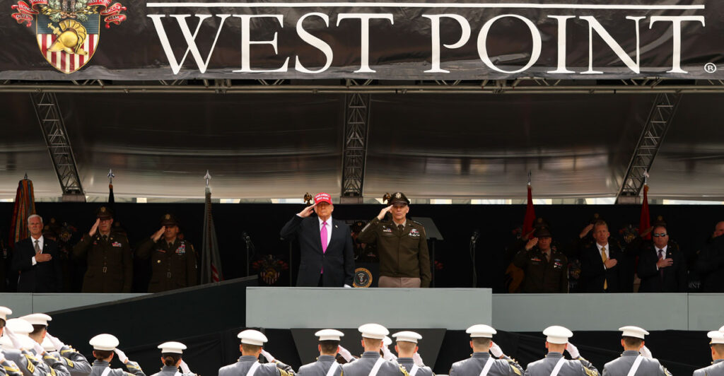 President Donald Trump and superintendent Lieutenant General Steven W. Gilland salute graduates of the United States Military Academy at West Point.