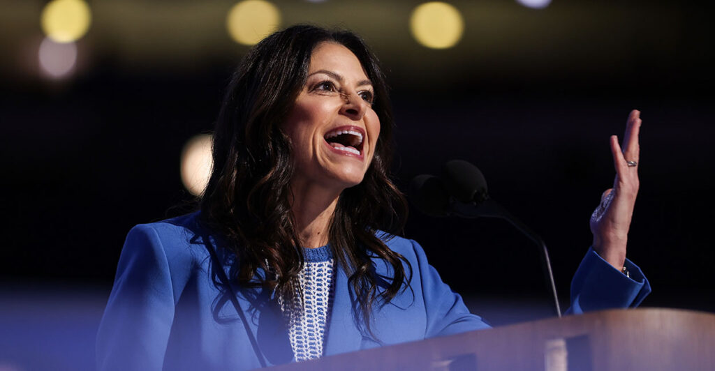 Dana Nessel in a blue suit gestures. The American Freedom Law Center is suing Nessel for endorsing the Southern Poverty Law Center's smear of AFLC as an "anti-Muslim hate group."