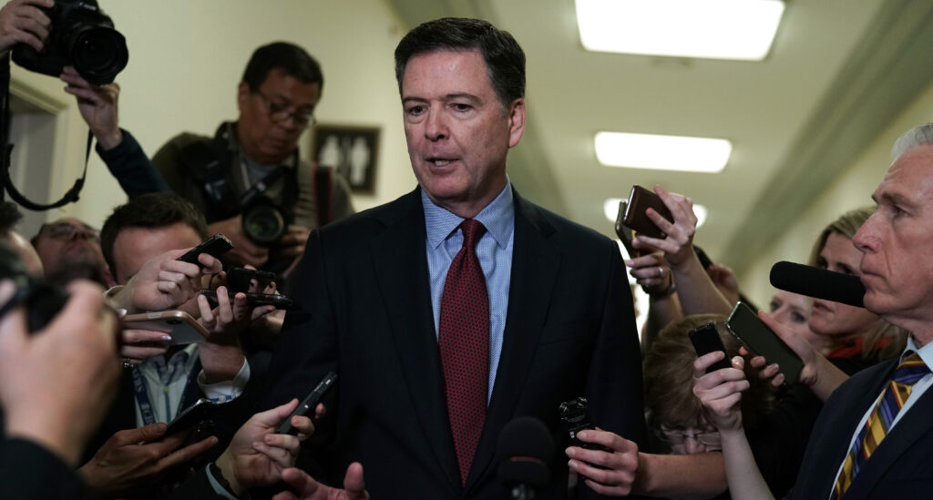 Former Federal Bureau of Investigation Director James Comey speaks to members of the media at the Rayburn House Office Building after testifying to the House Judiciary and Oversight and Government Reform committees on Capitol Hill December 07, 2018 in Washington, DC.