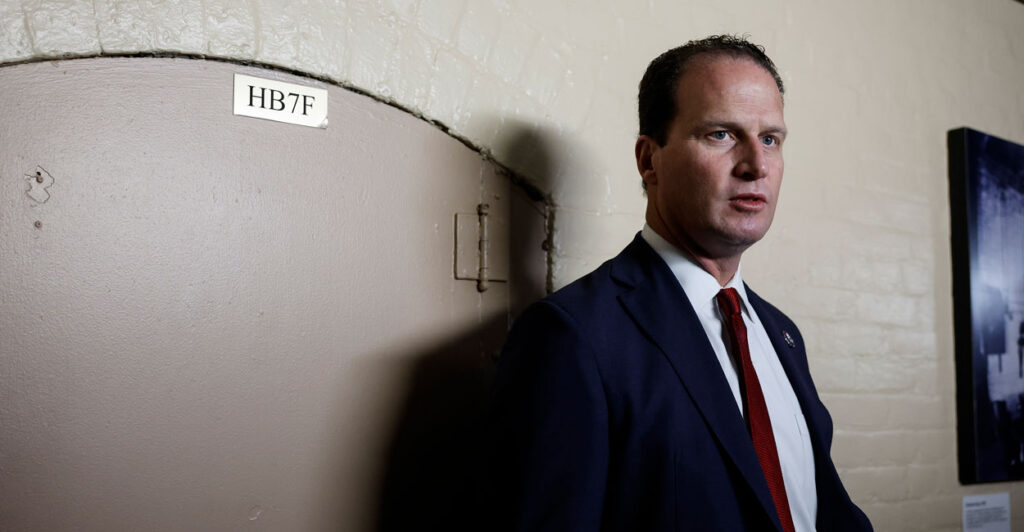 Rep. August Pfluger, R-Texas, speaks to reporters outside of a House Republican caucus meeting at the U.S. Capitol on Sept. 27, 2023.