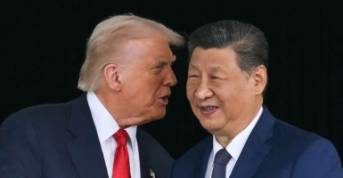President Donald Trump talks to Chinese leader Xi Jinping
