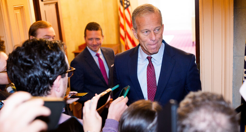 John Thune speaks to members of the press as he heads to his office in the Capitol Building on November 8, 2025 in Washington, DC.