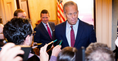 John Thune speaks to members of the press as he heads to his office in the Capitol Building on November 8, 2025 in Washington, DC.
