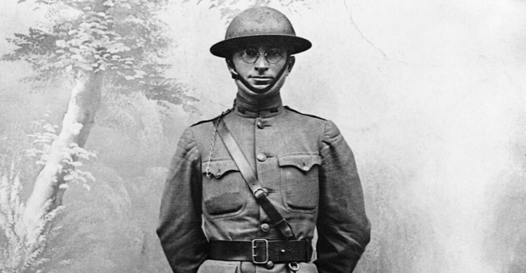 Harry Truman stands in military uniform during the first world war.