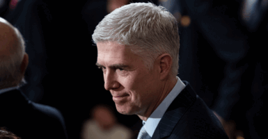 U.S. Supreme Court Associate Justice Neil M. Gorsuch waits for former U.S. President George H.W. Bush at the U.S Capitol December 03, 2018