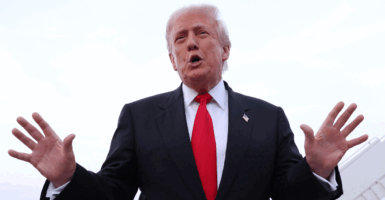 U.S. President Donald Trump gives brief remarks to the press after exiting Air Force One on November 9, 2025 at Joint Base Andrews, Maryland