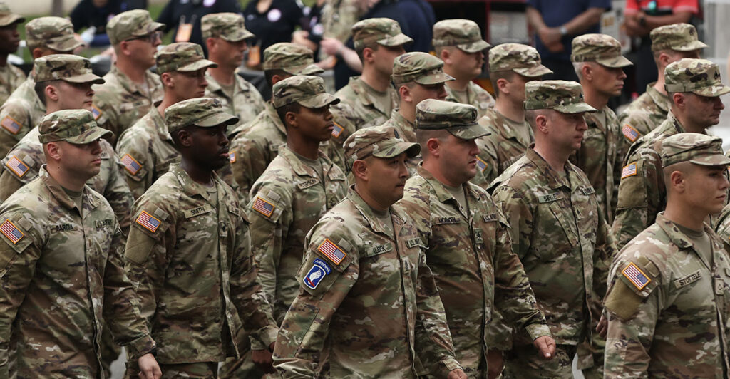 Army soldiers marching. The U.S. Army sponsored a school counselor association that promotes diversity, equity, and inclusion, arguably in violation of President Donald Trump's executive order.