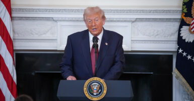 President Trump speaks from a podium in White House.