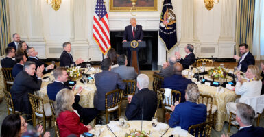 President Donald Trump speaks to senators.