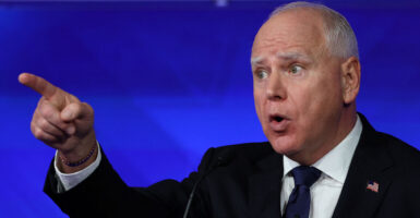 Minnesota Gov. Tim Walz gestures as he speaks during a debate with Republican vice presidential nominee U.S. Senator JD Vance.