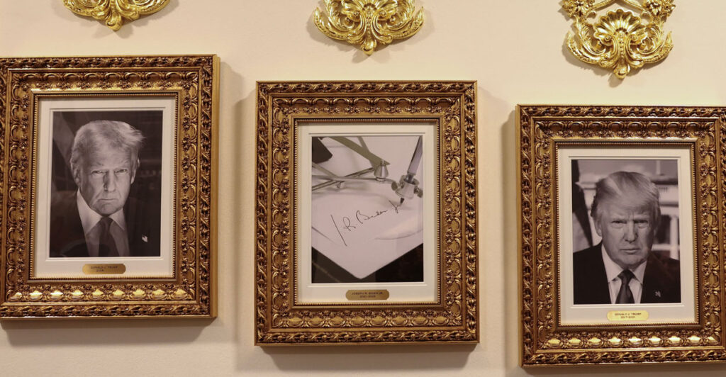 A portrait of the Joe Biden autopen flanked by portraits of Donald Trump.