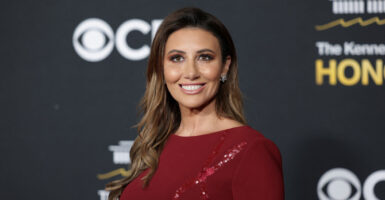 Alina Habba in a red gown on the red carpet at the Kennedy Center Honors.