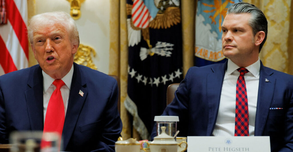 Donald Trump and Pete Hegseth sit at a Cabinet meeting.
