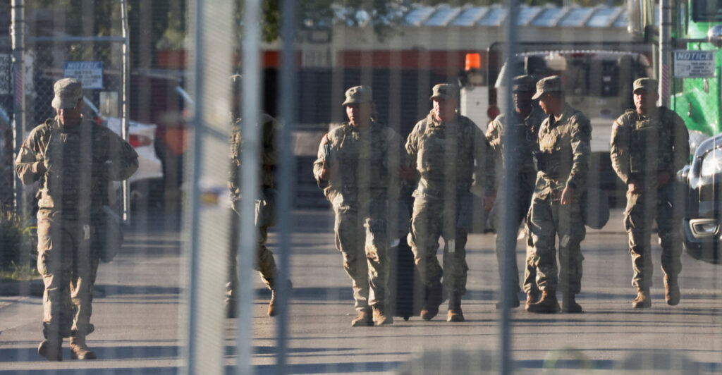 A group of National Guardsmen on a street.