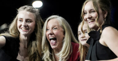 A laughing Abigail Spanberger, flanked by her three daughters.