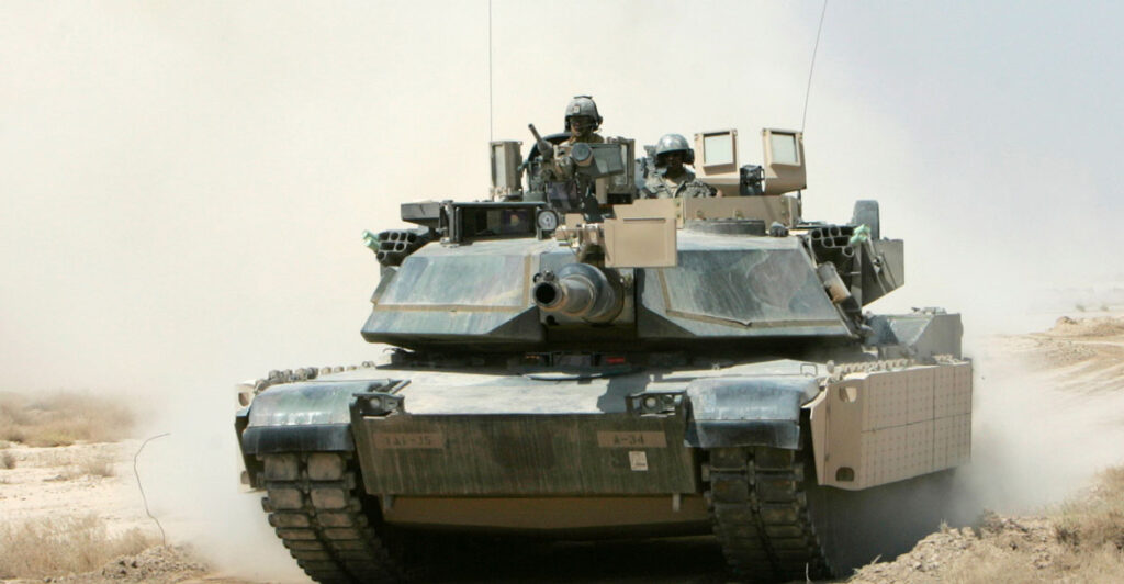 An M1A1 Abrams tank rumbles outside Baghdad.