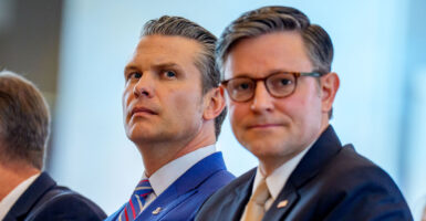 Secretary of War Pete Hegseth and Speaker of the House Mike Johnson sit together in the Capitol.