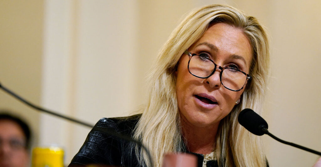 Marjorie Taylor Greene sits in capitol commitee.