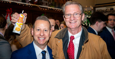 Tim Burchett and Jared Moskowitz at a Capitol Hill Christmas party.