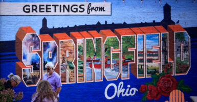A sign reads 'Greetings from Springfield, Ohio.'