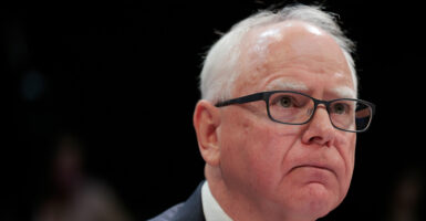 Close-up of a frowning Gov. Tim Walz,