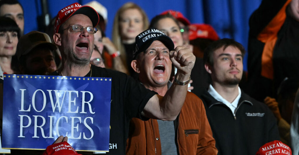 Attendees react as US President Donald Trump delivers remarks on the economy at Mount Airy Casino Resort in Mount Pocono, Pennsylvania, on December 9, 2025. (Photo by ANDREW CABALLERO-REYNOLDS / AFP via Getty Images)