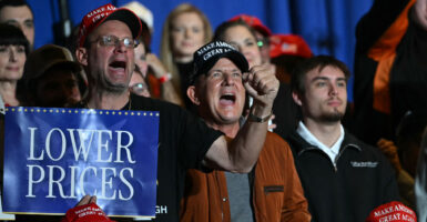Attendees react as US President Donald Trump delivers remarks on the economy at Mount Airy Casino Resort in Mount Pocono, Pennsylvania, on December 9, 2025. (Photo by ANDREW CABALLERO-REYNOLDS / AFP via Getty Images)