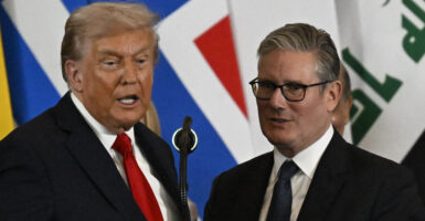 US President Donald Trump stands next to Britain's Prime Minister Keir Starmer as he delivers a statement during a summit on Gaza in Sharm el-Sheikh on October 13, 2025. Trump landed in Egypt on October 13 for a summit on Gaza, following a lightning visit to Israel after a ceasefire he brokered entered into force. (Photo by Khaled DESOUKI / AFP) (Photo by KHALED DESOUKI/AFP via Getty Images)