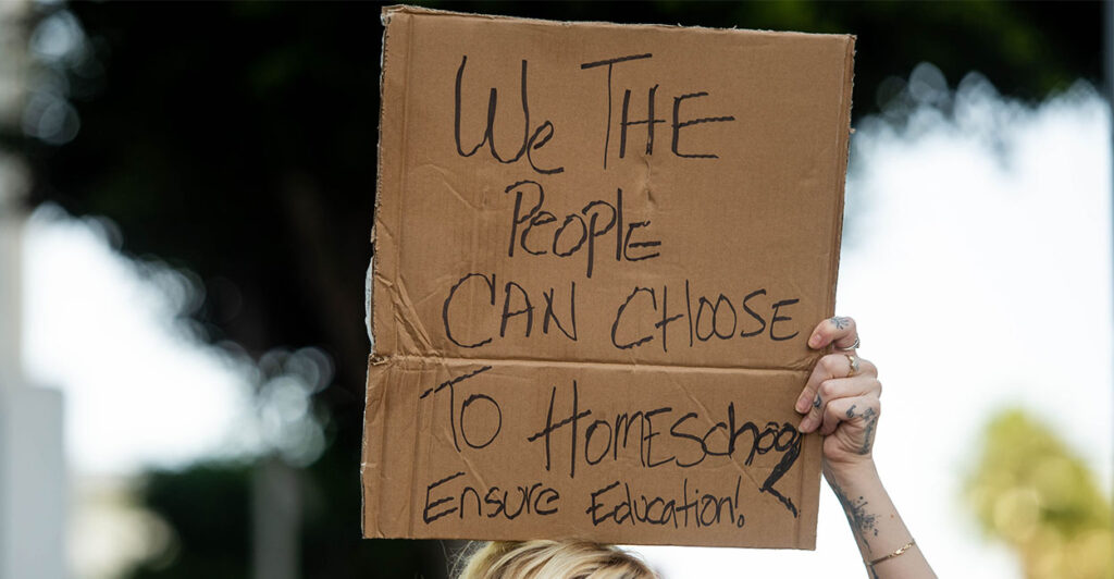 Los Angeles, CA - September 09:Vivian, of Los Angeles, who homeschools two children, protests at LAUSD Headquarters in Los Angeles the school board voting in a student COVID-19 vaccine mandate for children 12 and up on Thursday, September 9, 2021. (Photo by Sarah Reingewirtz/MediaNews Group/Los Angeles Daily News via Getty Images)