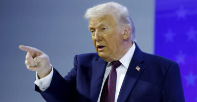 DAVOS, SWITZERLAND - JANUARY 22: U.S. President Donald Trump gestures after holding a signing ceremony for the “Board of Peace” at the World Economic Forum (WEF) on January 22, 2026 in Davos, Switzerland. The US-backed “Board of Peace” is intended to administer the fragile ceasefire in the Gaza Strip after the war between Israel and Hamas. The final makeup of the board has not been confirmed. (Photo by Chip Somodevilla/Getty Images)