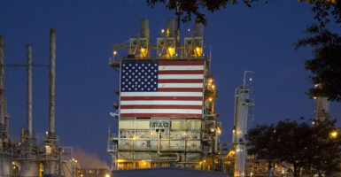 Wilmington, California, An oil refinery, operated by BP, displays a huge American flag. (Photo by: Jim West/UCG/Universal Images Group via Getty Images)