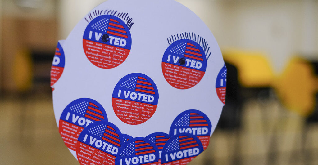 A detail view shows a smiling face made from ''I Voted'' stickers during early in-person voting for the California Statewide Special Election on October 29, 2025, in Los Angeles, California. Voters head to the polls on Tuesday, November 4, 2025, to vote Yes or No on Proposition 50, which implements a new congressional map for the next three election cycles in California. (Photo by Michael Yanow/NurPhoto via Getty Images)