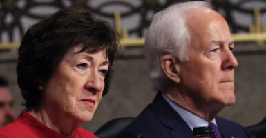 Republican Sens. Susan Collins of Maine and John Cornyn of Texas sit in committee.