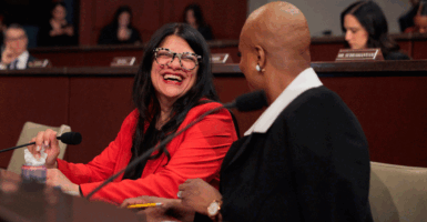WASHINGTON, DC - JANUARY 07: U.S. Rep. Rashida Tlaib (D-MI) (L) and U.S. Rep. Ayanna Pressley (D-MA) speak prior to a House Oversight and Government Reform Committee hearing about the Trump Administration's decision to freeze $10 billion in child care funds for families with low incomes in California, Colorado, Illinois, Minnesota and New York at the U.S. Capitol on January 07, 2026 in Washington, DC. Federal prosecutors filed charges against dozens of people in Minnesota, many from the area's Somali community, with stealing upwards of billions of taxpayer dollars through fraudulent social services schemes. (Photo by Chip Somodevilla/Getty Images)