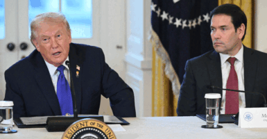 US President Donald Trump speaks as US Secretary of State Marco Rubio (R) looks on during a meeting with US oil companies executives in the East Room of the White House in Washington, DC on January 9, 2026. President Trump is aiming to convince oil executives to support his plans in Venezuela, a country whose energy resources he says he expects to control for years to come. US forces seized Venezuelan president Nicolas Maduro in a sweeping military operation on January 3, with Trump making no secret that control of Venezuela's oil was at the heart of his actions. (Photo by SAUL LOEB / AFP via Getty Images)