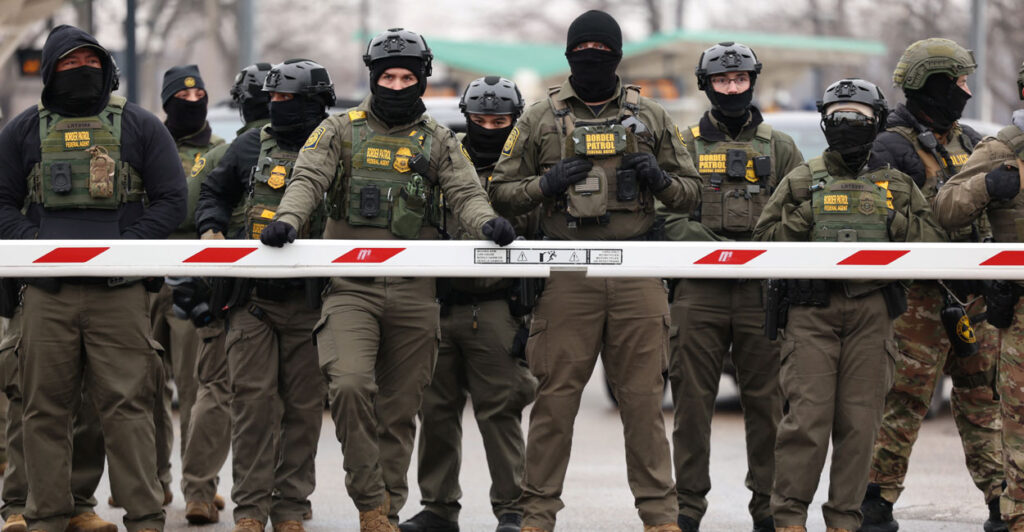 US Border Patrol agents stand guard at the Bishop Henry Whipple Federal Building in Minneapolis, Minnesota, on January 8, 2026.