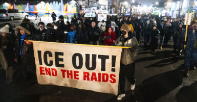 Protesters march against ICE after an ICE agent shot Renee Nicole Good, a member of an ICE Watch group.