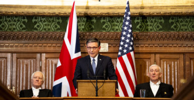 US House Speaker Mike Johnson (C) addresses MPs in the House of Commons alongside Speaker of the House of Lords, Lord McFall (L) and Speaker of the House of Commons Sir Lindsay Hoyle (R) on January 20, 2026 in London, England.