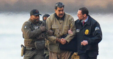 Nicolas Maduro is seen in handcuffs after landing at a Manhattan helipad,